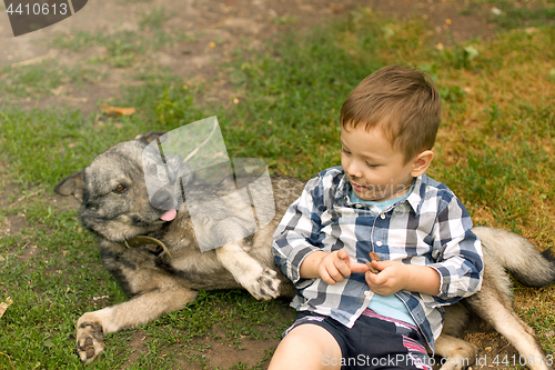 Image of Boy hugging his dog