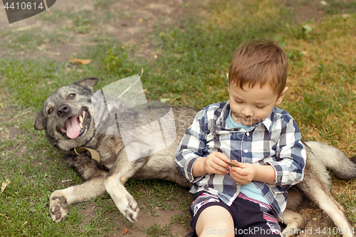 Image of Boy hugging his dog