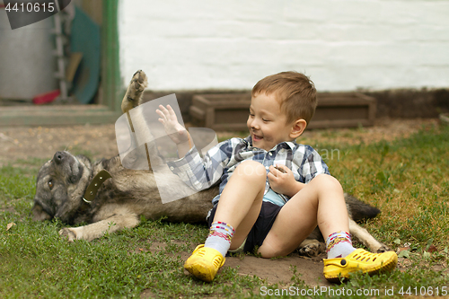 Image of Boy hugging his dog