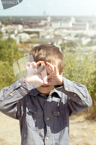Image of Boy pretending that he is a cameraman