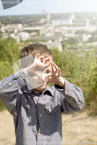 Image of Boy pretending that he is a cameraman