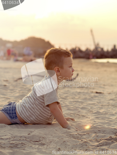 Image of Happy boy playing on the beach