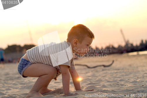 Image of Happy boy playing on the beach