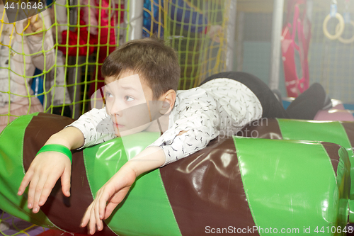 Image of Playing room in mall with tired boy