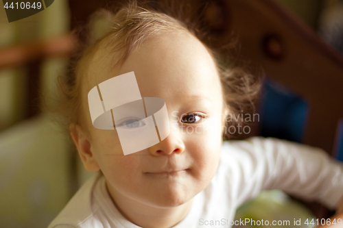 Image of Portrait of a baby boy looking on camera