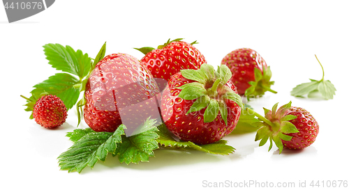 Image of fresh red strawberries with green leaves