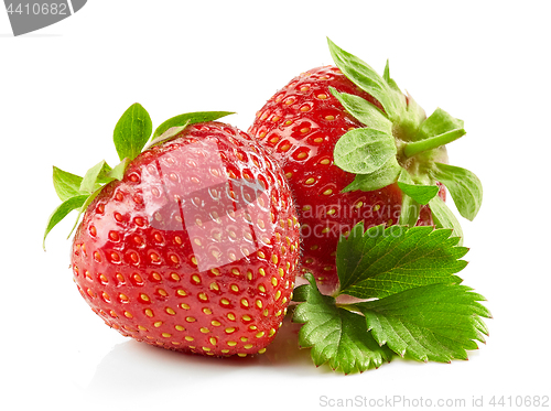 Image of fresh red strawberries with green leaves