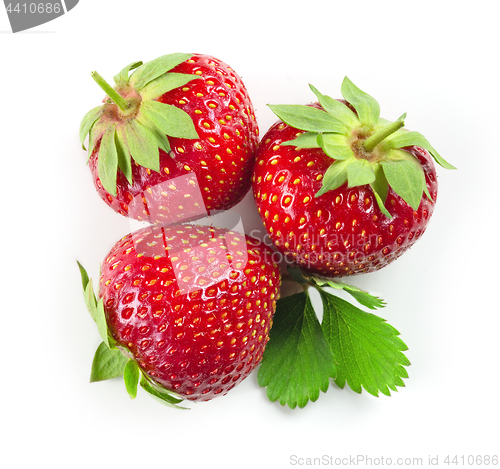 Image of fresh red strawberries with green leaves