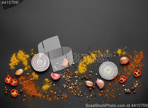 Image of various spices on black background