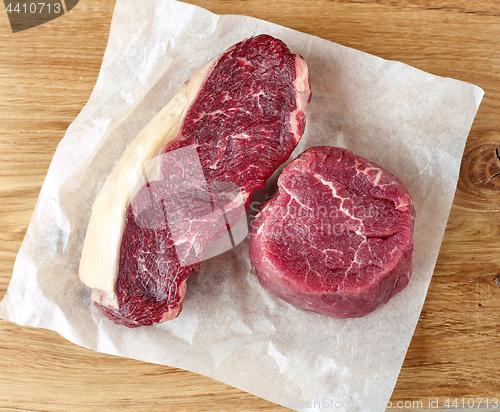 Image of raw strip loin and fillet mignon steak