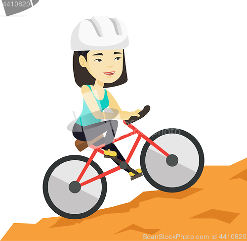 Image of Young woman on bicycle traveling in the mountains.