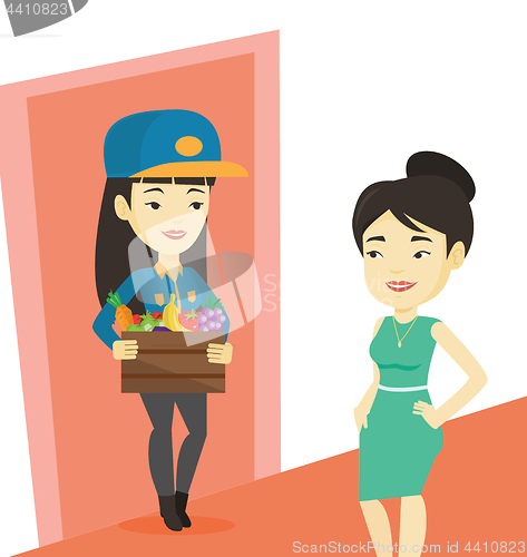 Image of Delivery courier delivering groceries to customer.
