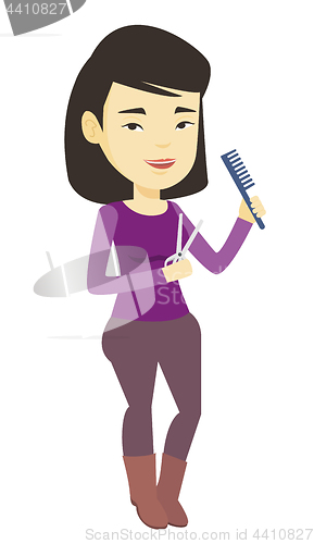 Image of Hairstylist holding comb and scissors in hands.