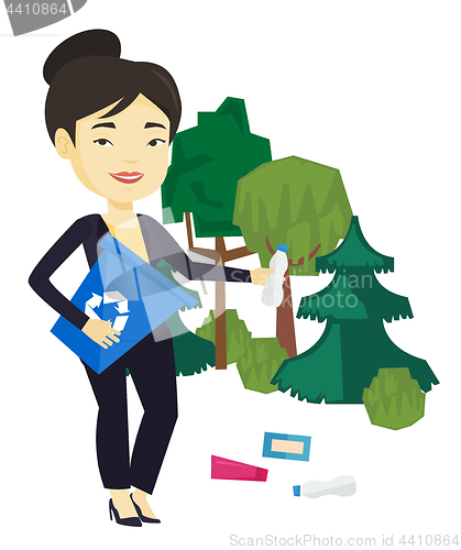 Image of Woman collecting garbage in forest.