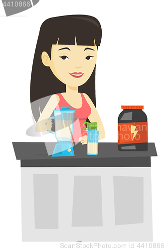 Image of Young woman making protein cocktail.