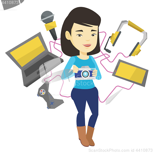 Image of Young woman surrounded with her gadgets.