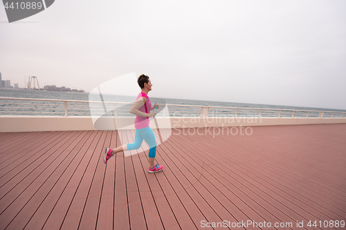 Image of woman running on the promenade