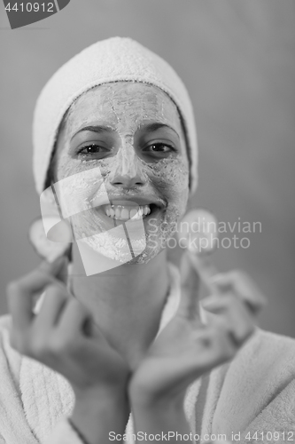 Image of Spa Woman applying Facial Mask