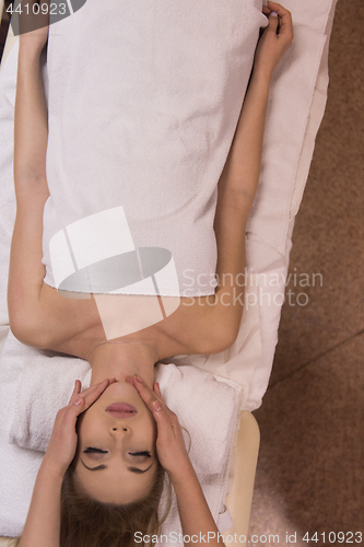 Image of woman receiving a head massage