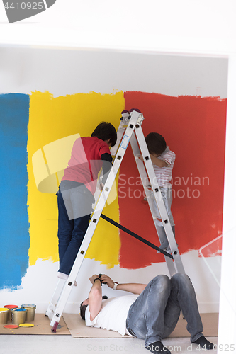 Image of boys painting wall