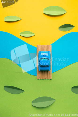 Image of Vintage miniature car in trendy color, travel concept