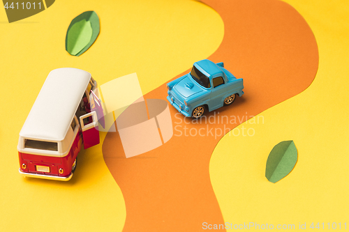 Image of Vintage miniature car and bus in trendy color, travel concept
