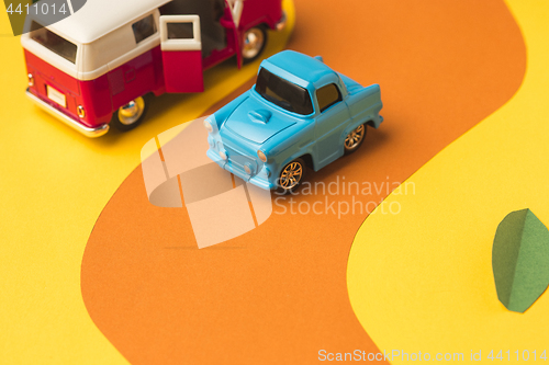 Image of Vintage miniature car and bus in trendy color, travel concept