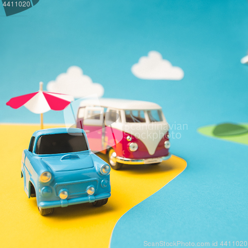 Image of Vintage miniature car and bus in trendy color, travel concept