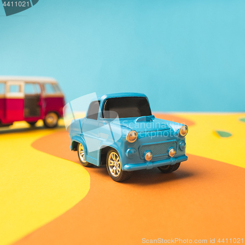 Image of Vintage miniature car and bus in trendy color, travel concept