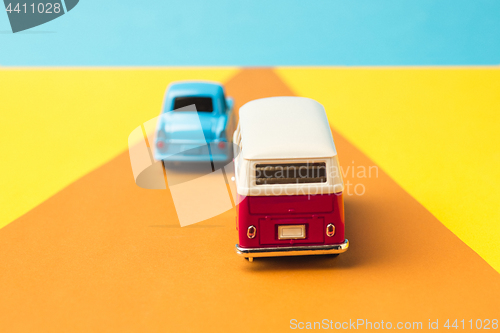 Image of Vintage miniature car and bus in trendy color, travel concept