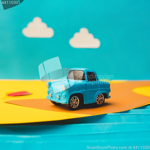 Image of Vintage miniature car in trendy color, travel concept