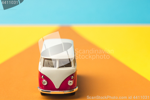 Image of Vintage miniature bus in trendy color, travel concept