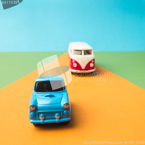 Image of Vintage miniature car and bus in trendy color, travel concept