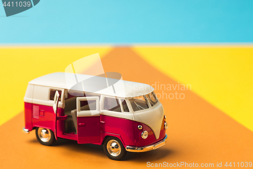 Image of Vintage miniature bus in trendy color, travel concept