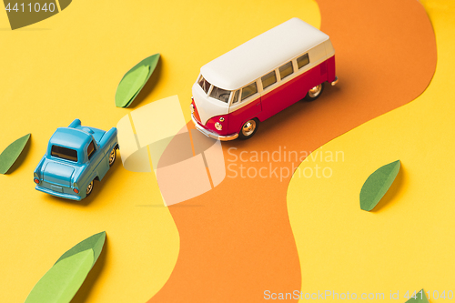 Image of Vintage miniature car and bus in trendy color, travel concept