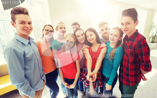 Image of group of students taking selfie with smartphone