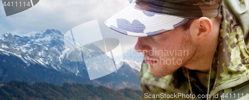 Image of close up of young soldier in military uniform