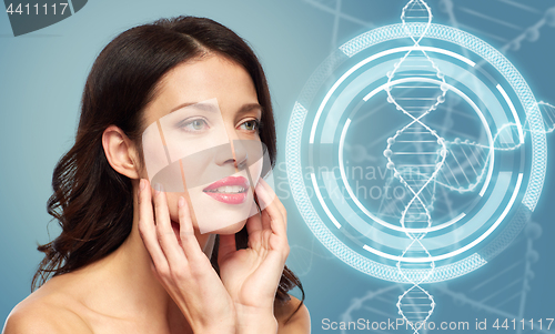 Image of woman with red lipstick over dna molecule