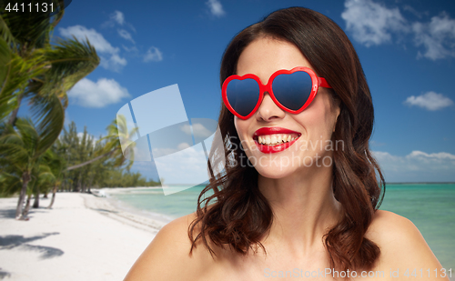 Image of woman with red lipstick and heart shaped shades