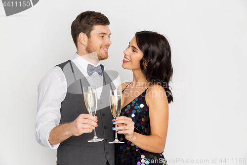 Image of happy couple with champagne glasses at party