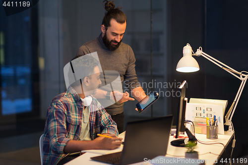 Image of creative team with tablet pc working at office