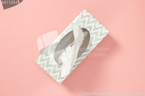 Image of Tissue box on pastel pink background