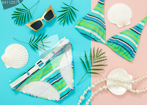 Image of Tropical summer flat lay on turquoise and pink background