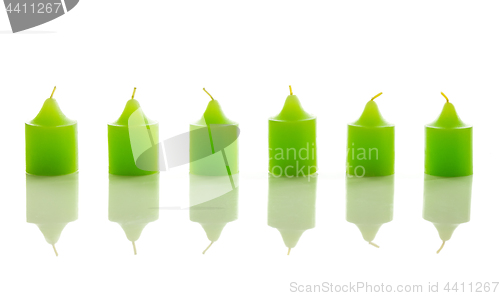 Image of Green candles on white background
