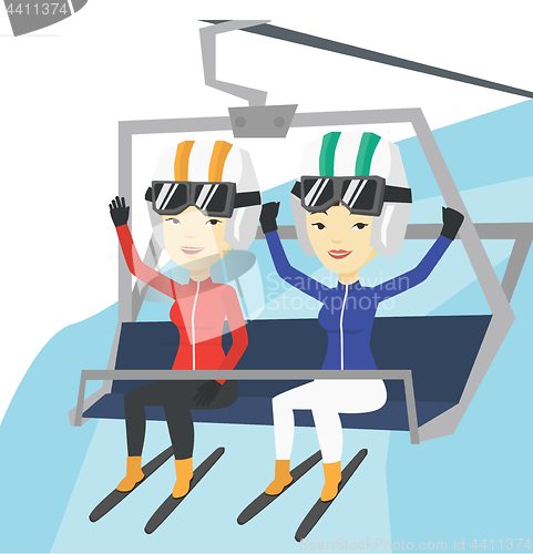 Image of Two happy skiers using cableway at ski resort.