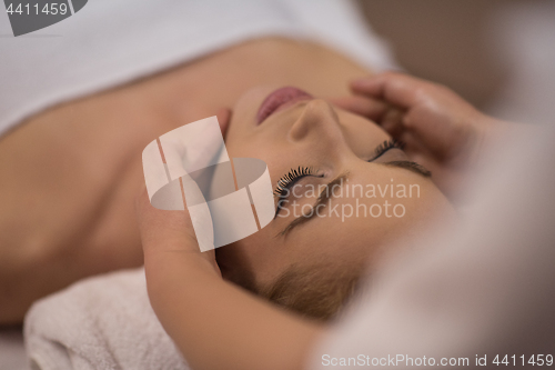 Image of woman receiving a head massage