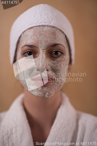 Image of Spa Woman applying Facial Mask