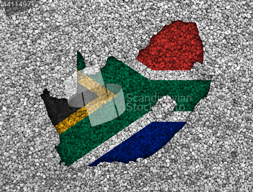 Image of Map and flag of South Africa on poppy seeds