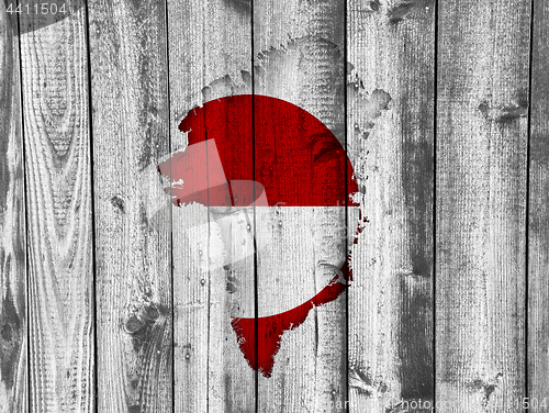 Image of Map and flag of Greenland on weathered wood