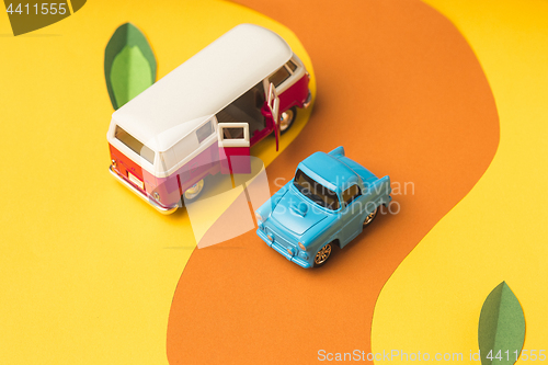 Image of Vintage miniature car and bus in trendy color, travel concept